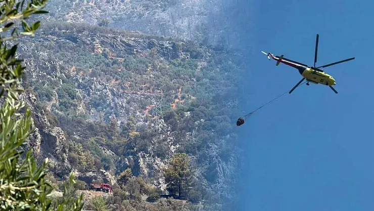 Fethiye'deki orman yangını sonrası soğutma çalışmaları havadan ve karadan sürüyor